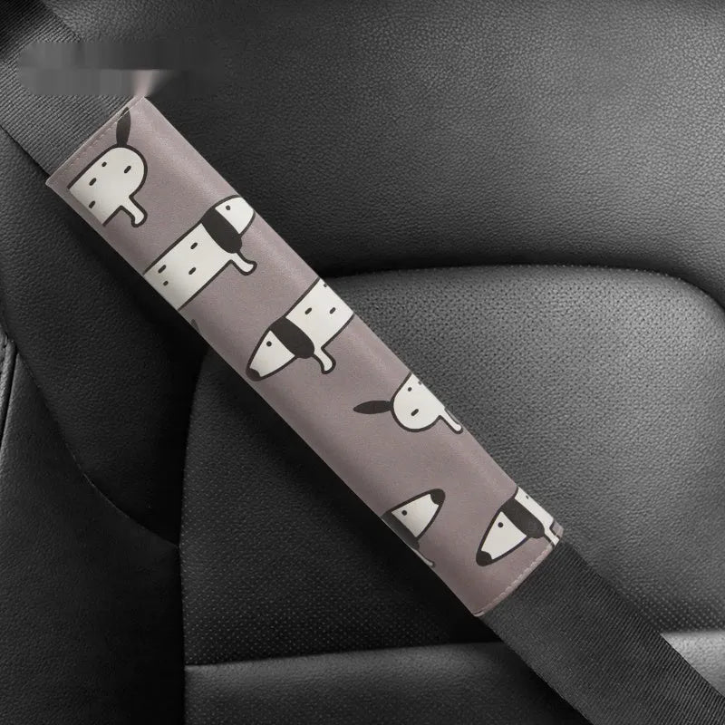 Cute Dachshund cartoon design on a black PU leather car seat belt shoulder protector sleeve.
