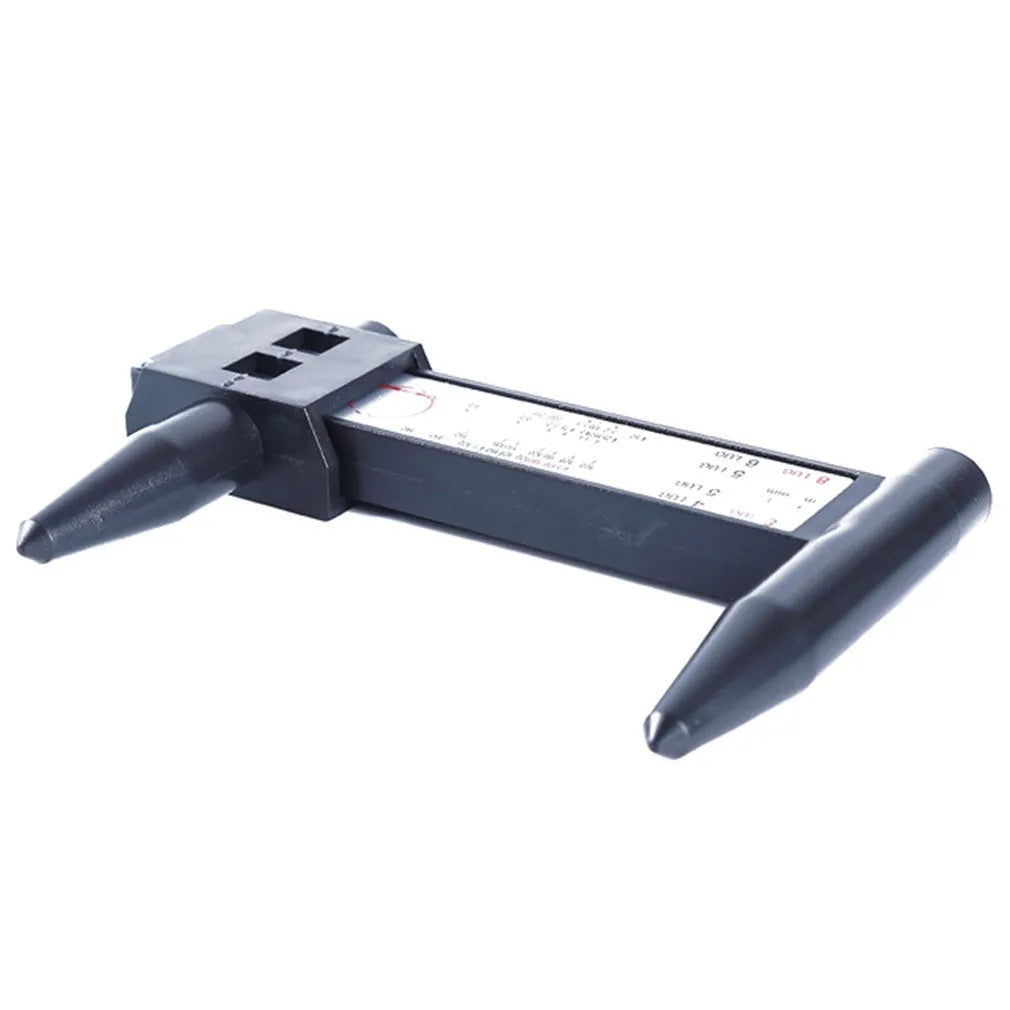 Plastic electronic digital caliper hole distance ruler on a white background.