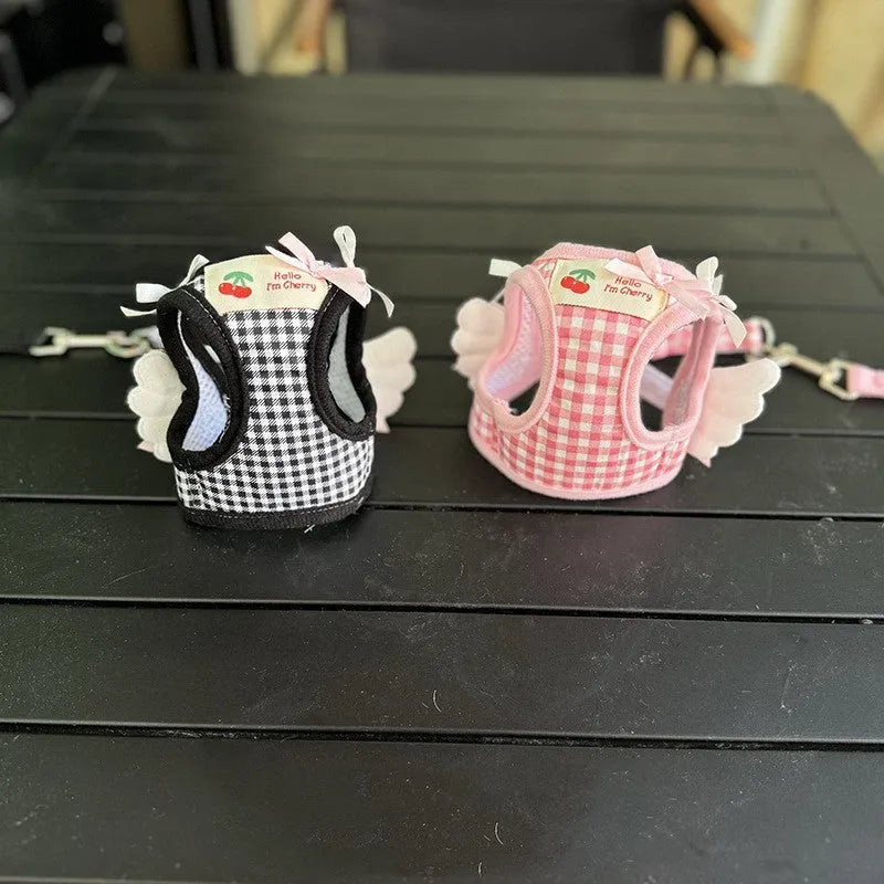 Soft cotton chest and back harness for a small dog, with hand-holding rope, shown in pink colour.