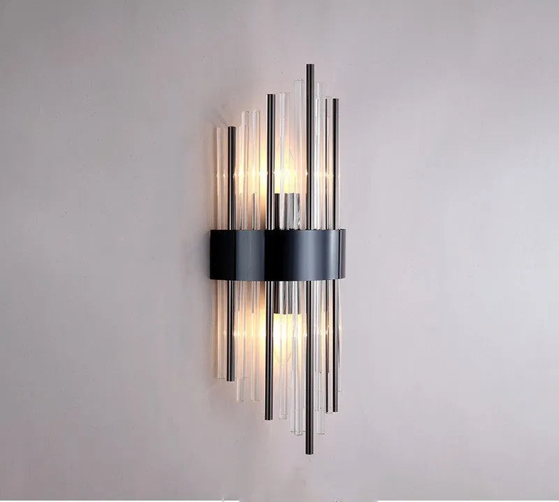 Modern crystal wall lamp with petal design and titanium gold finish mounted on wall