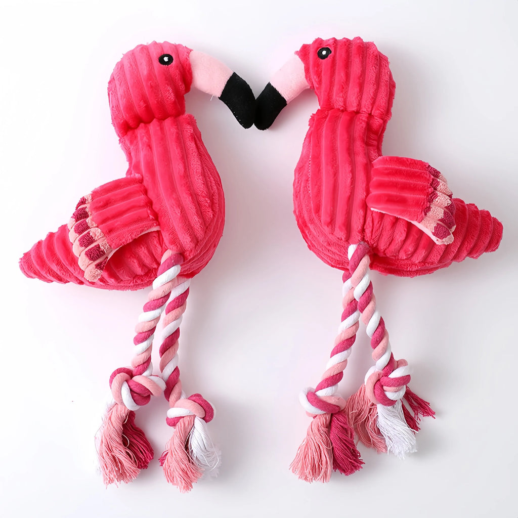 Pink corduroy animal-shaped plush dog toy with a squeaker inside on a neutral background.
