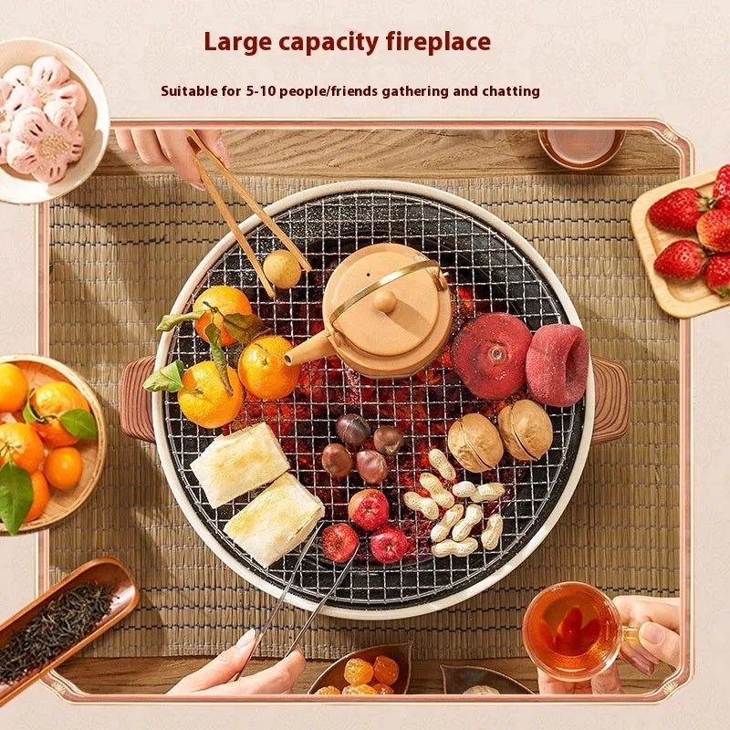 Compact round indoor charcoal stove with removable metal grill rack, for smokeless tabletop cooking.