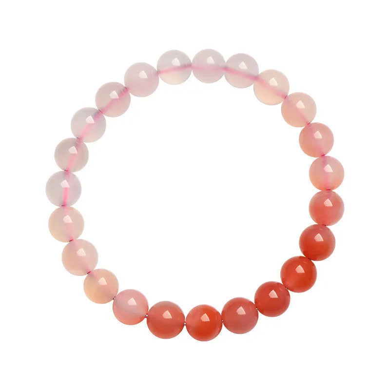 Natural gradient salt source colour Yanyuan agate bracelet with geometric beads on a wrist.