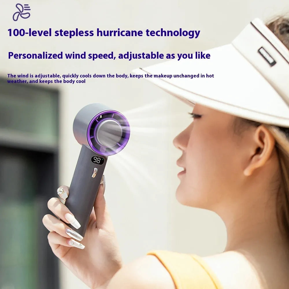 White portable handheld turbo fan with cooling function and display, shown on a table.