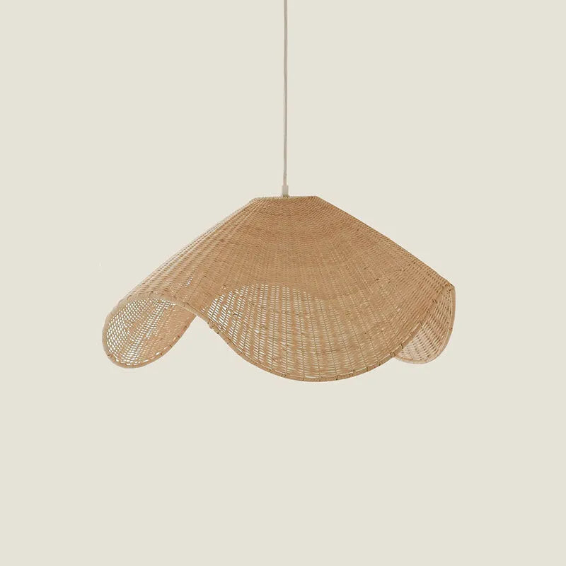 Handmade bamboo rattan chandelier with woven straw and willow lampshade in warm light