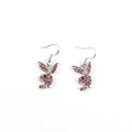 Close-up of rabbit-shaped stud earrings with sparkling cubic zirconia stones in gold, pink, and silver finishes.