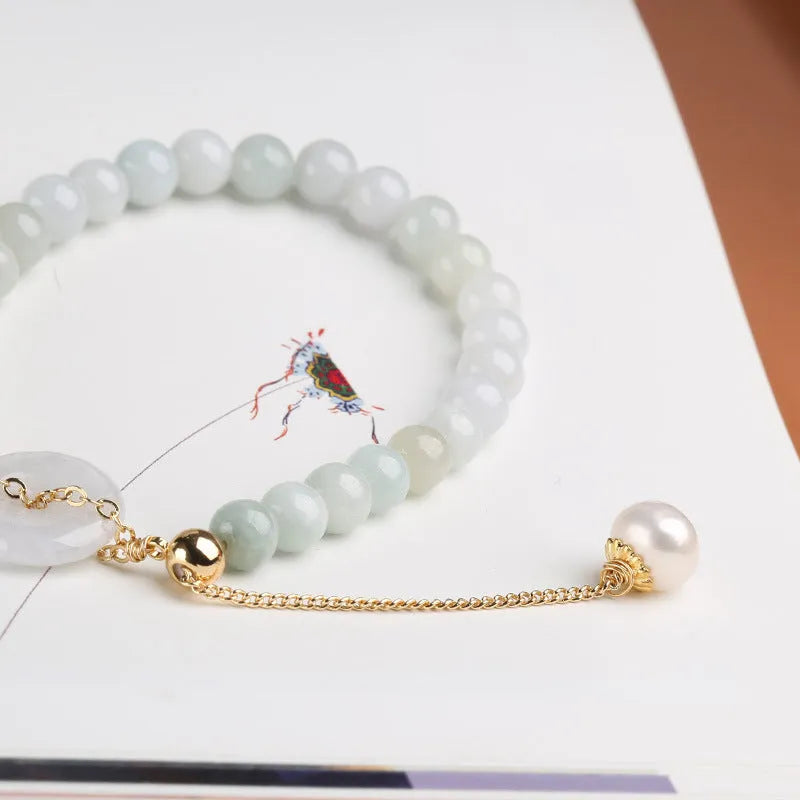Natural emerald green jade bracelet with pearl accents and peace symbol buckle clasp
