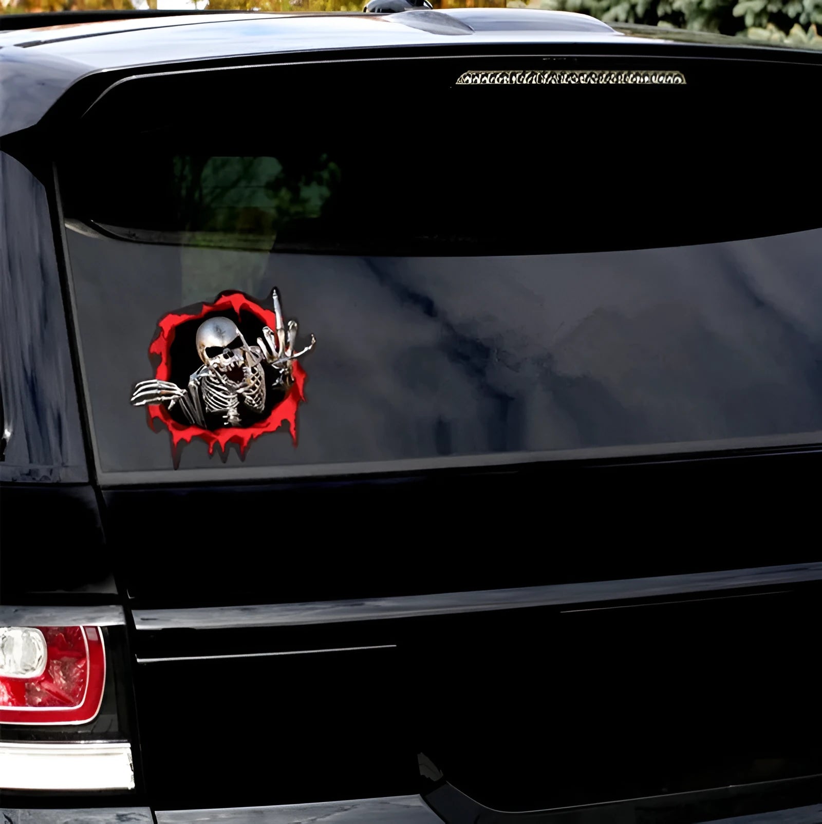 Colourful broken shell peeping metal skull design on a 15cm by 14cm car bumper sticker.