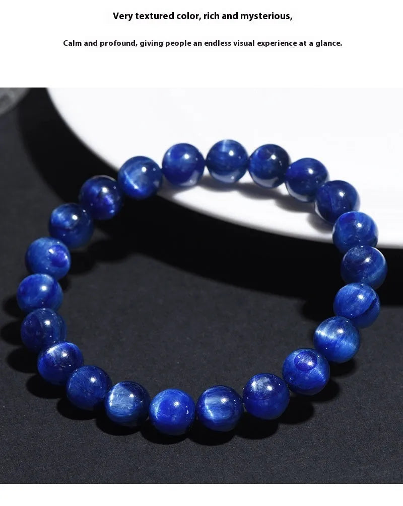 Natural blue crystal ball bracelet with geometric shape and Ruyi design on a white background.