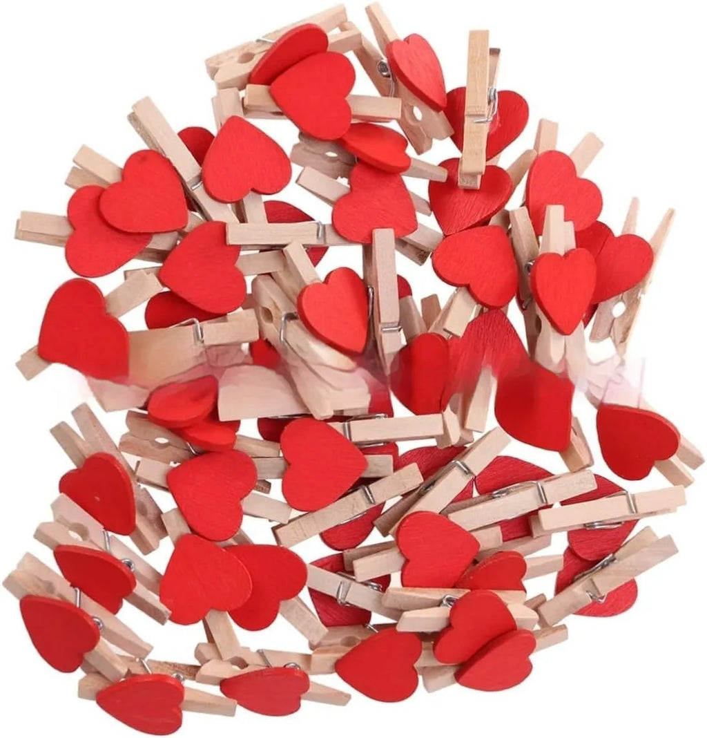 Set of five solid wood heart-shaped hair clips in red, white, and rose red on a plain background.