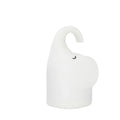 DOMI Elephant shaped silicone night light on a table showing its compact size and soft glow.
