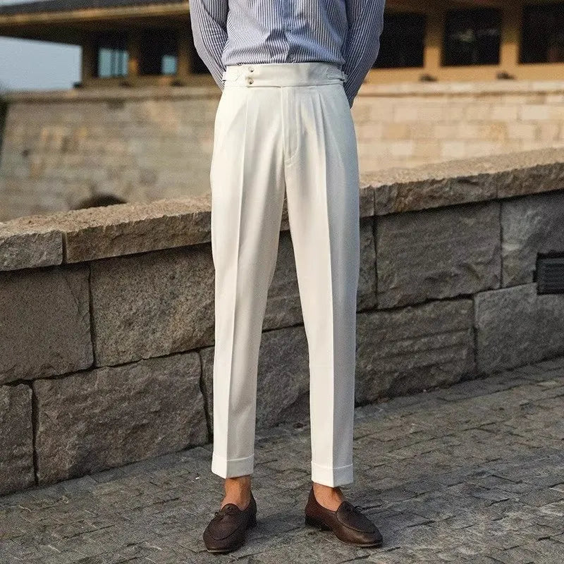 Men's slim fit straight leg suit trousers in black, white, or apricot colour on a hanger.