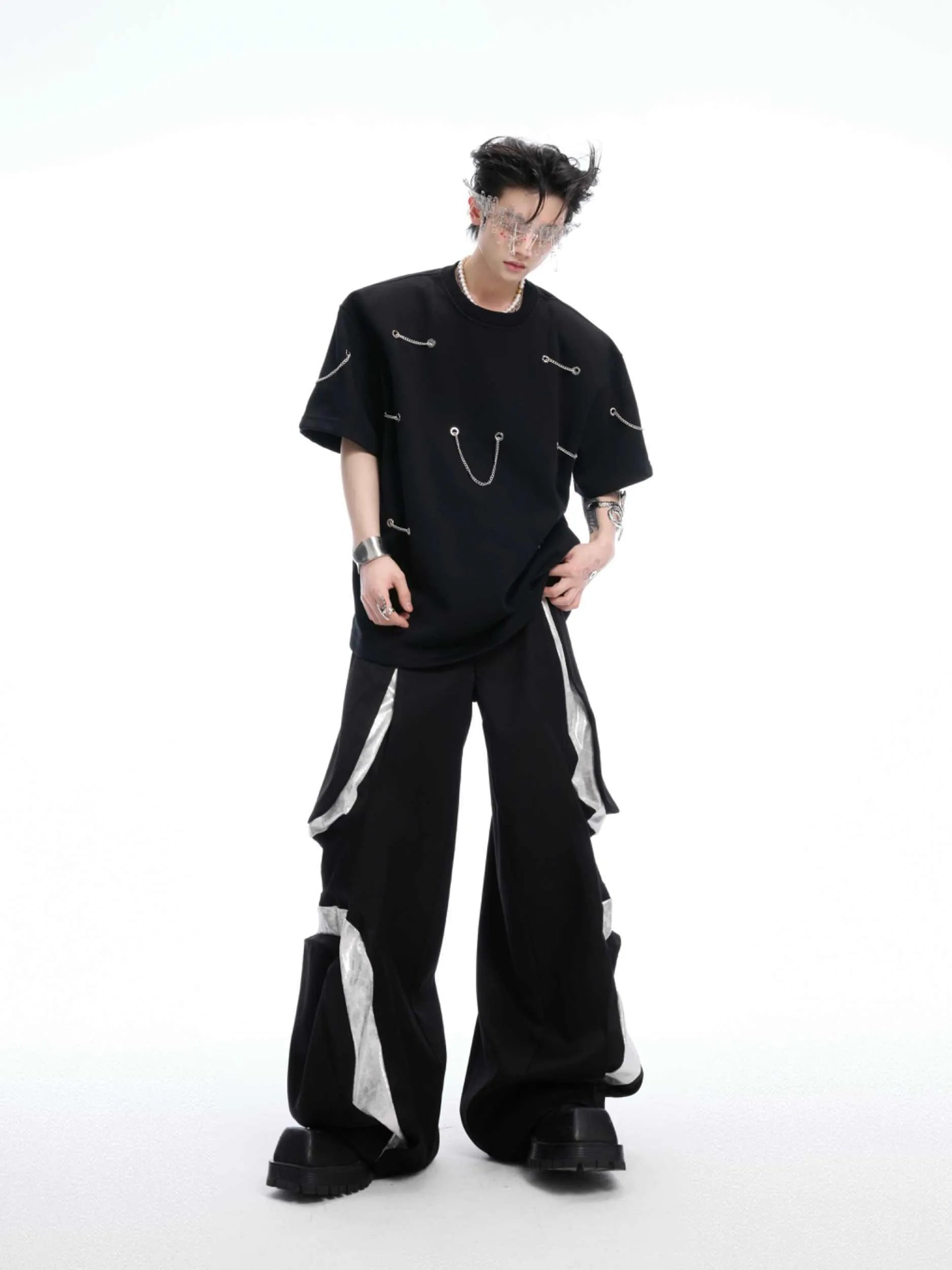 Black heavy cotton t-shirt with padded shoulder panels and silver metal chain decorative details