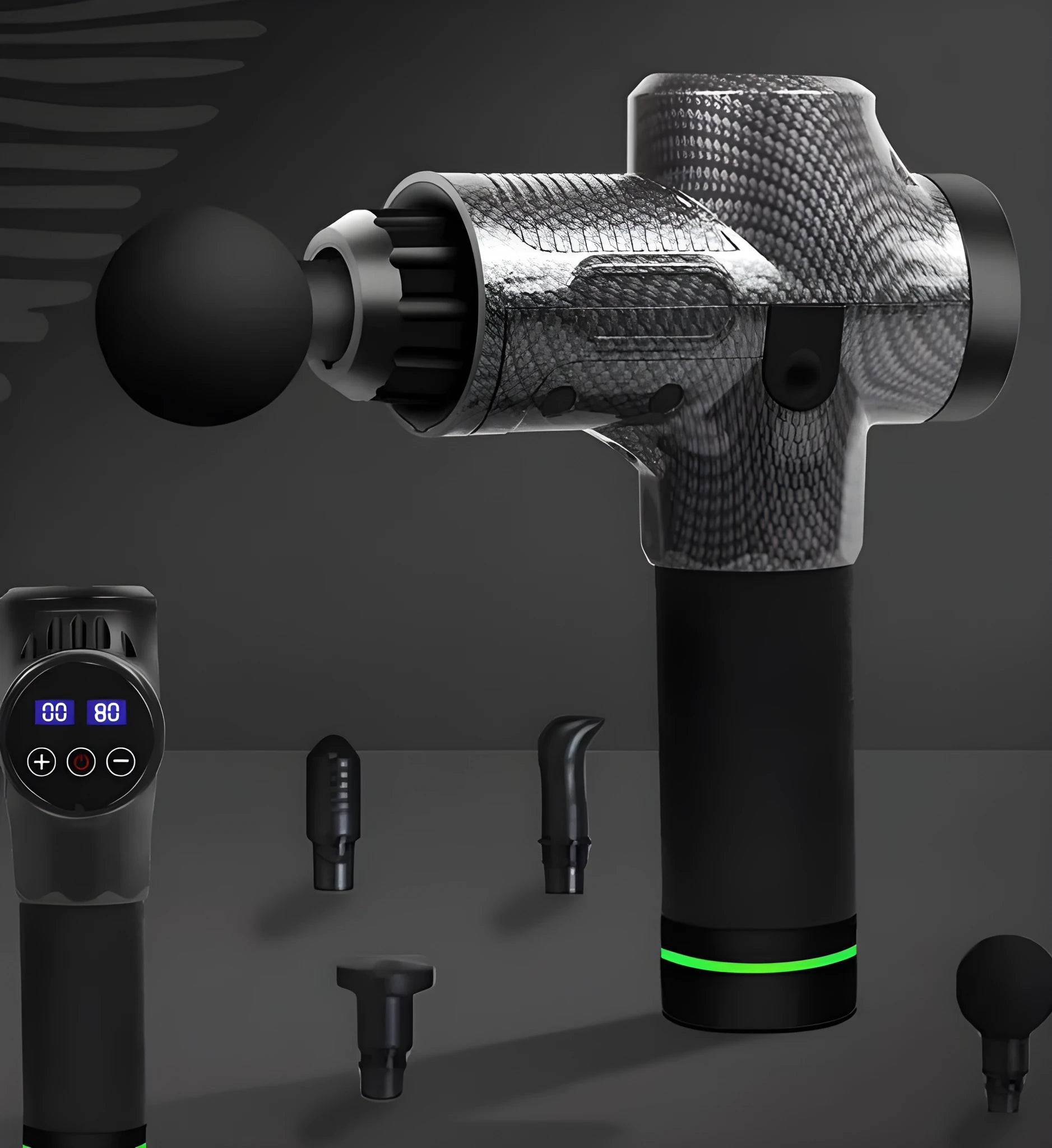 Black electric muscle massage gun with multiple attachment heads on a table.