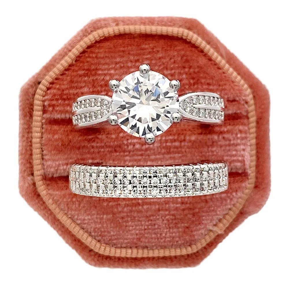 White gold colour alloy wedding ring bracelet with geometric shape and round elements.