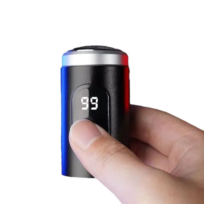 Black mini USB rechargeable electric shaver with cleaning brush and charging cable on a white background.