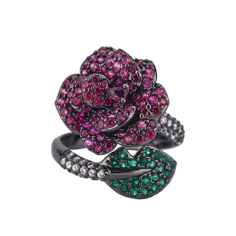 Geometric black gold plated flower ring with red simulated corundum stones for women.