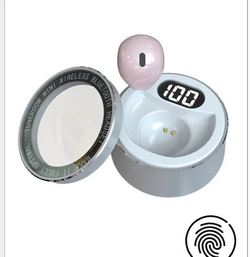 Close-up of a tiny skin-toned 9mm Bluetooth earpiece designed to be invisible in the ear.