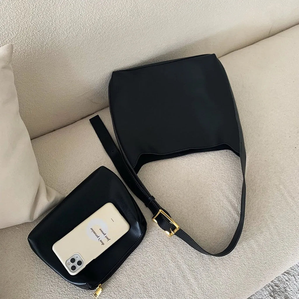 Women's soft PU shoulder bag with swing threads decoration showing black and brown colour options