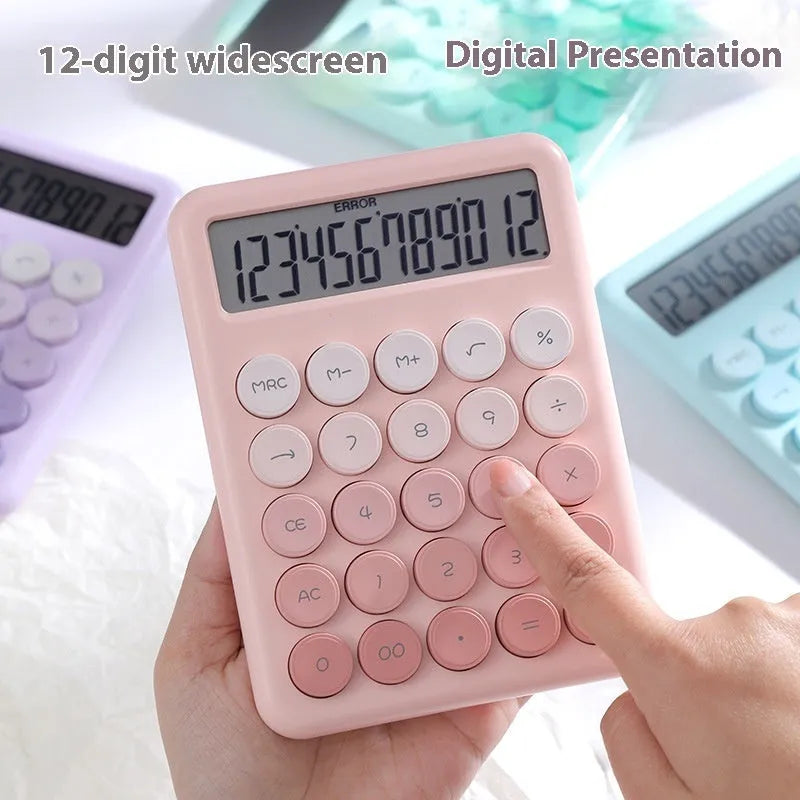 Gradient colour desktop calculator in violet, pink, blue, and green shades on a desk.