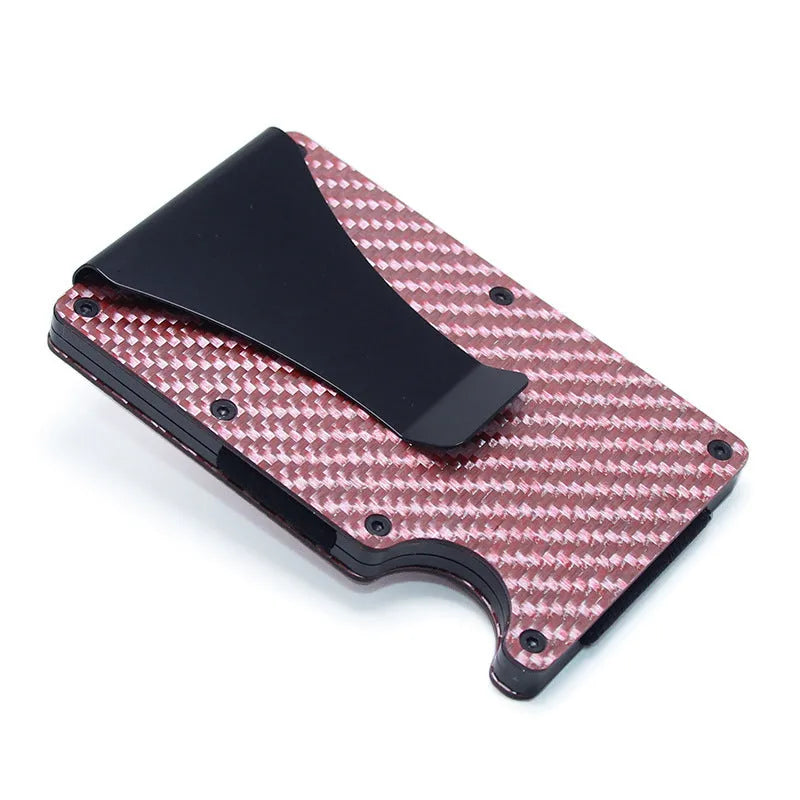 Slim black carbon fibre geometric wallet holding bank cards, showing 8mm thickness profile.