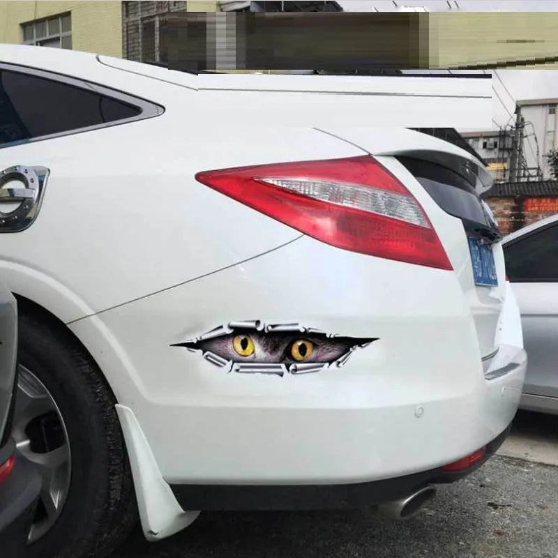3D Tiger Eye or Eagle Eye pattern car door sticker on a vehicle bumper.
