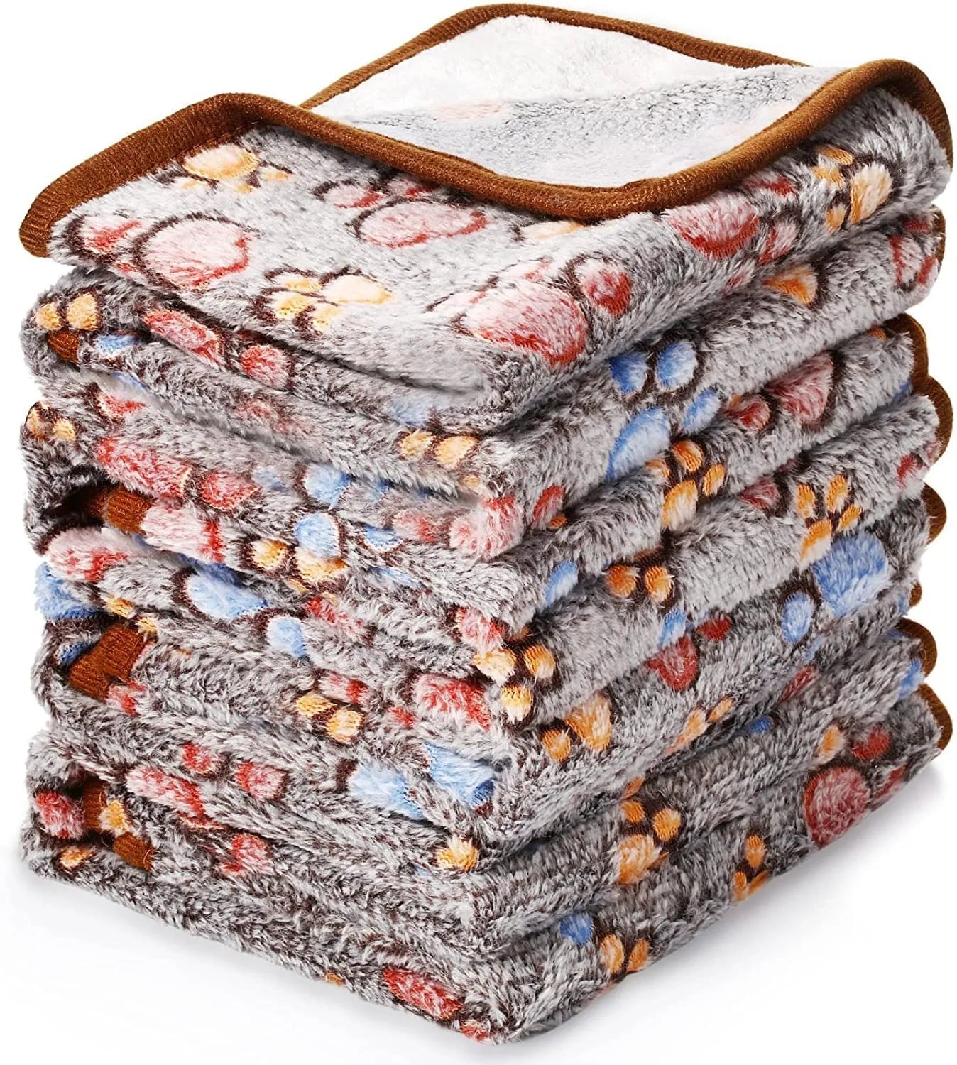 Coral fleece pet blanket with dog paw print pattern shown in beige colour, lying flat to show size