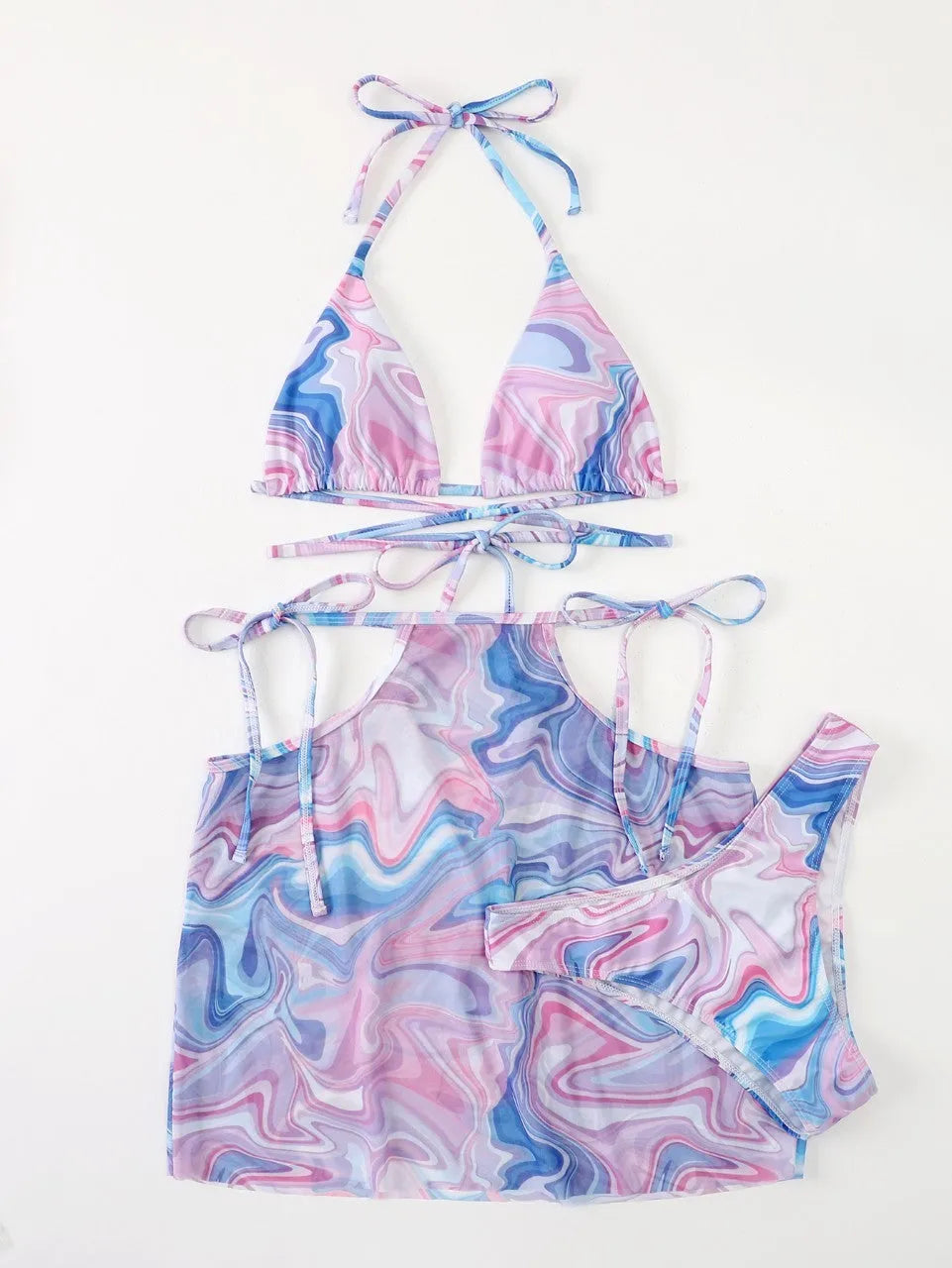 Lavender 3-piece women's bikini set with sheer beach skirt on display