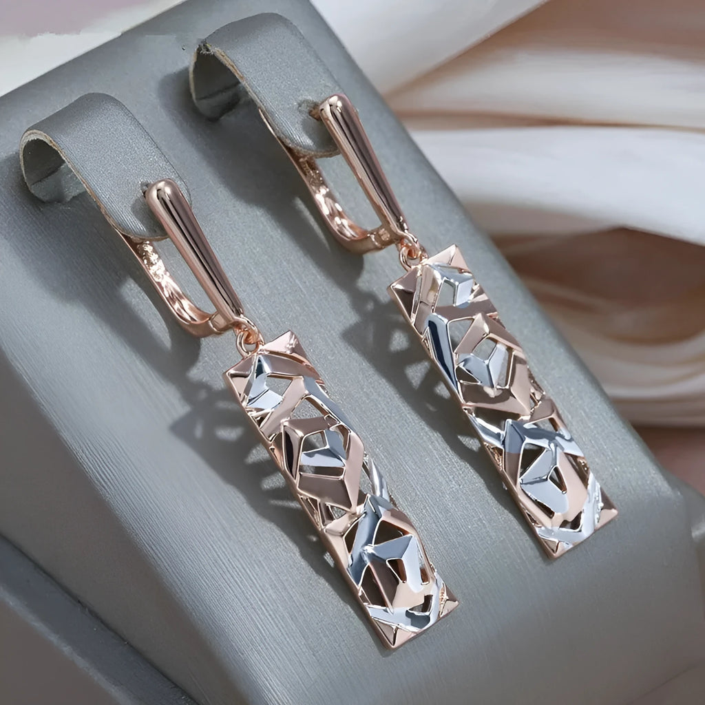 A pair of rectangular two-tone hollow stud earrings with an electroplated picture-style finish.