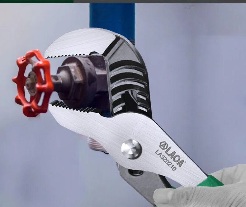 Multi-functional adjustable water pipe wrench in chrome vanadium steel on a workbench.