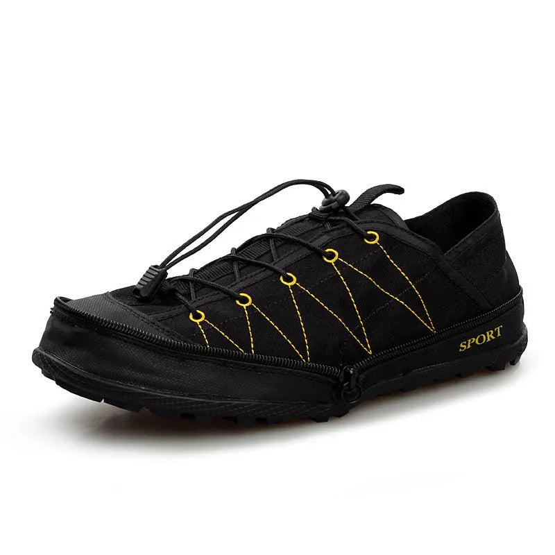 Orange folding outdoor hiking shoe with mesh upper and side zip closure laid flat.