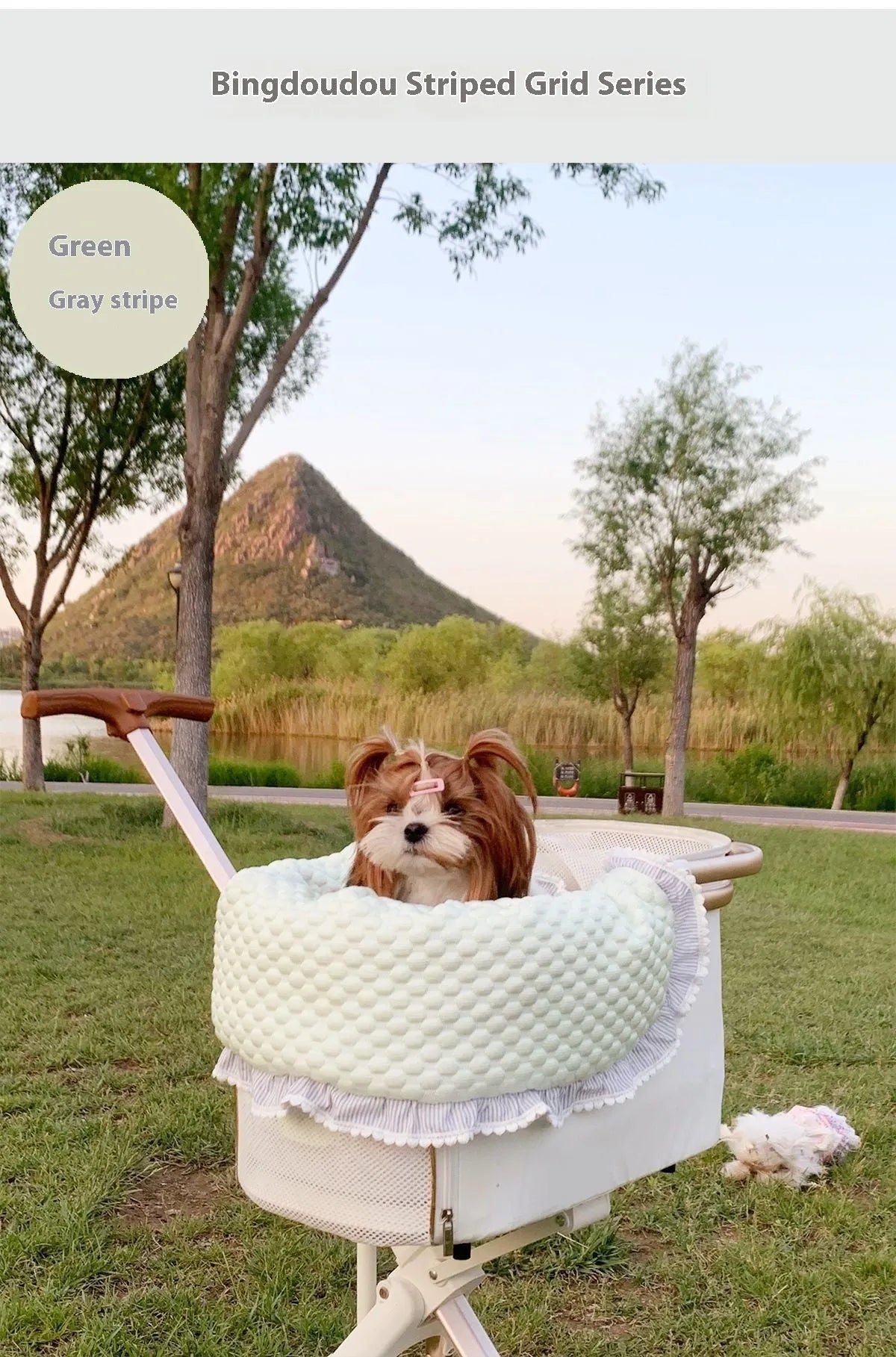 A green grey striped towel, cushion, and pillow set for a pet stroller, shown removed and ready for washing.