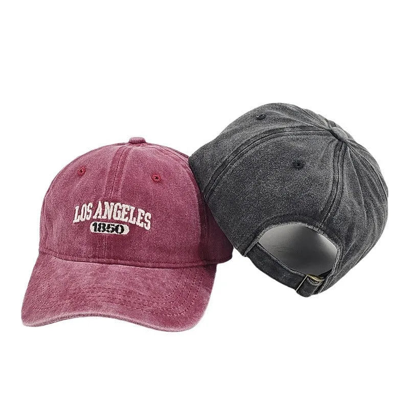 Retro distressed personalised baseball cap with embroidered letters on the front, showing adjustable strap.