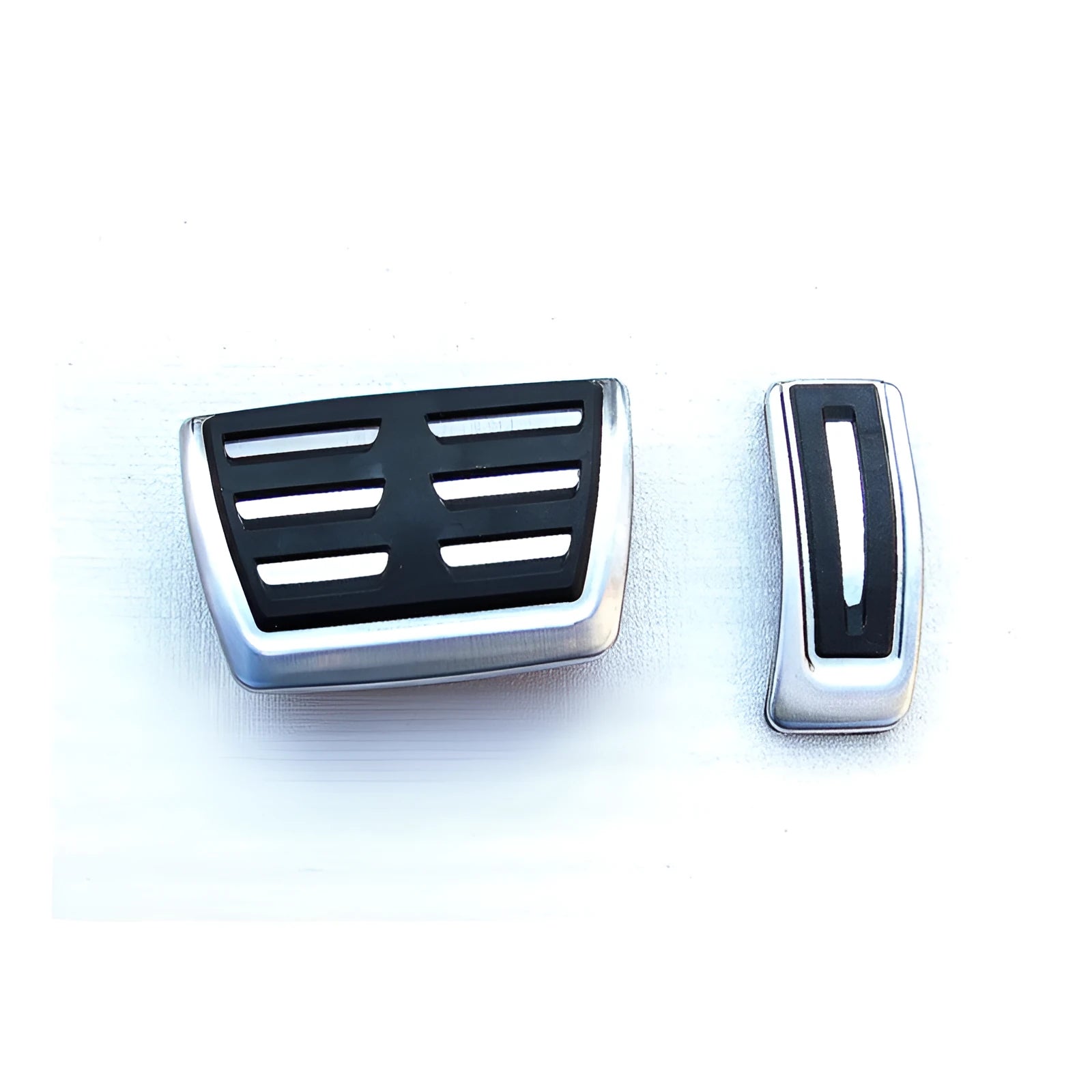 Stainless steel foot rest pedal for Porsche Macan in black.