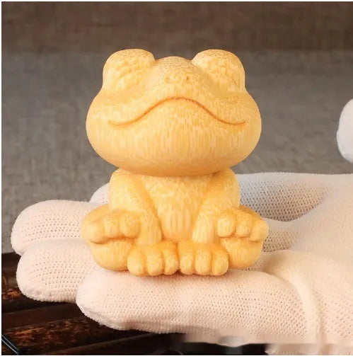 Solid bamboo smiling frog carving ornament measuring 5cm high with cartoon cute style