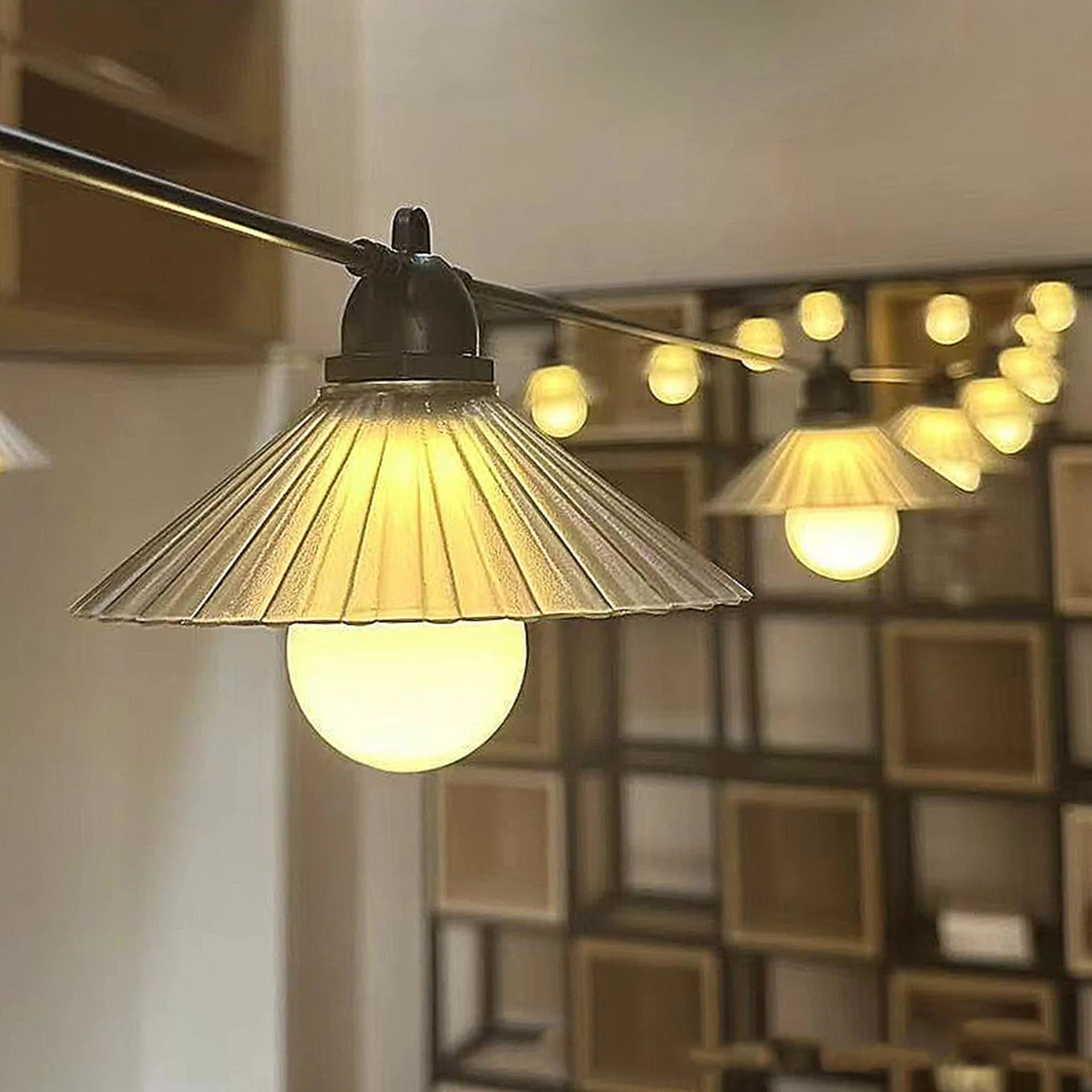 Outdoor LED string lights with flower-shaped bulbs in warm white and multi-colour options.
