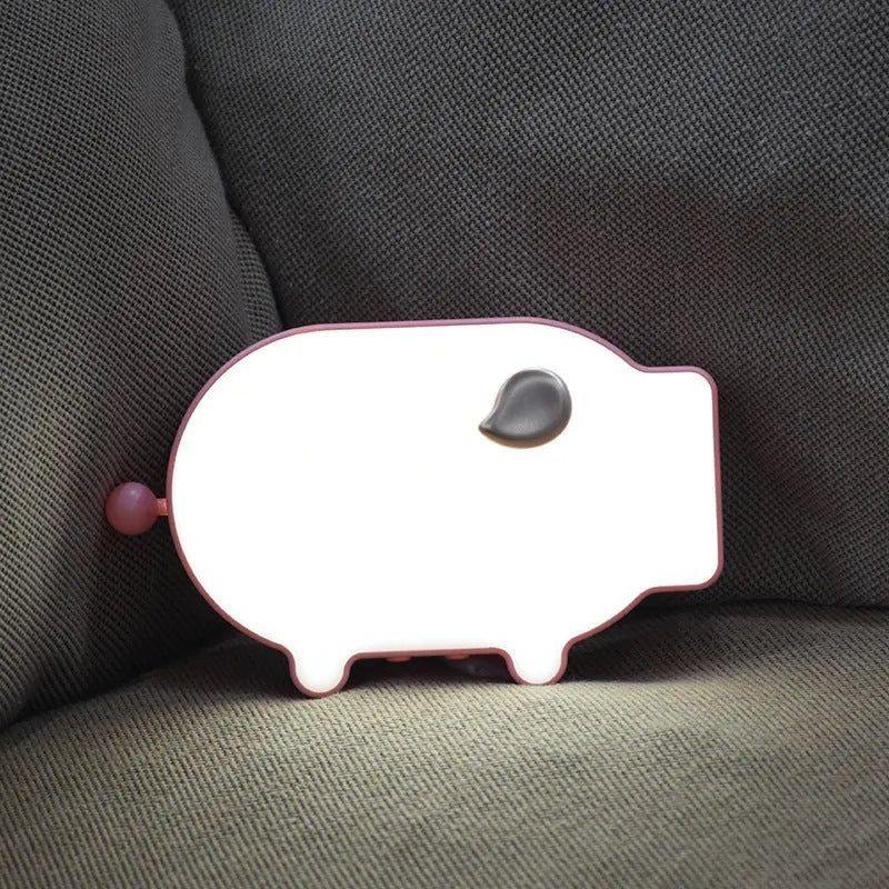 Blue and pink multifunctional LED alarm clock showing time, temperature, and a USB charging port.