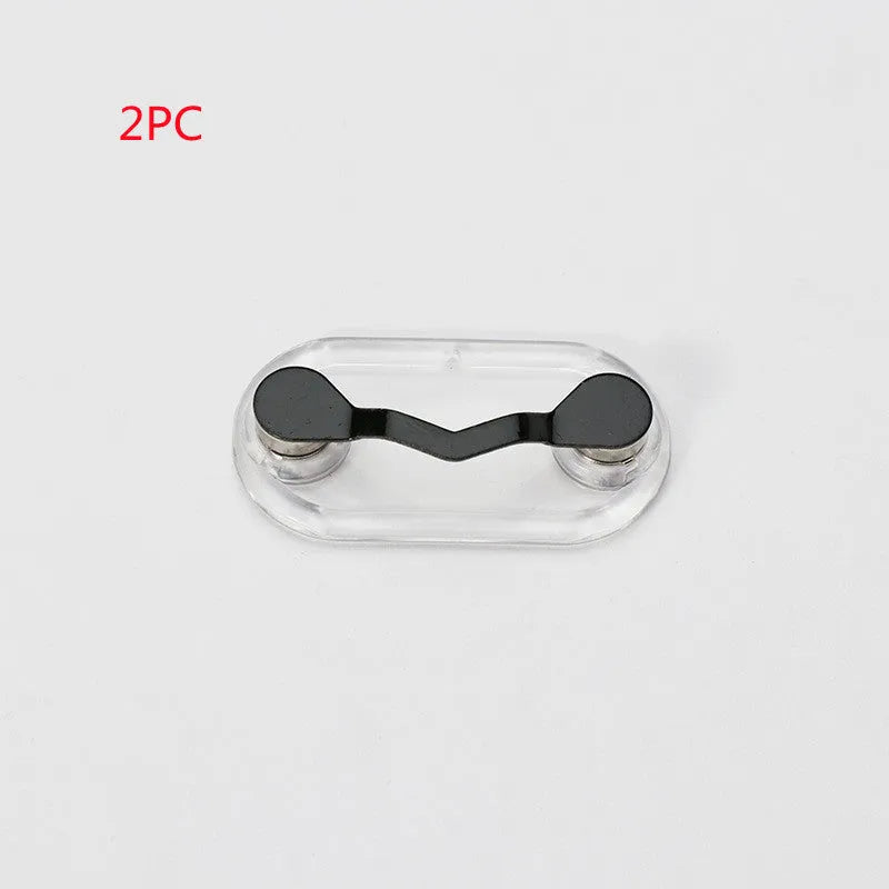 Black magnetic glasses holder on a fridge door with spectacles stored