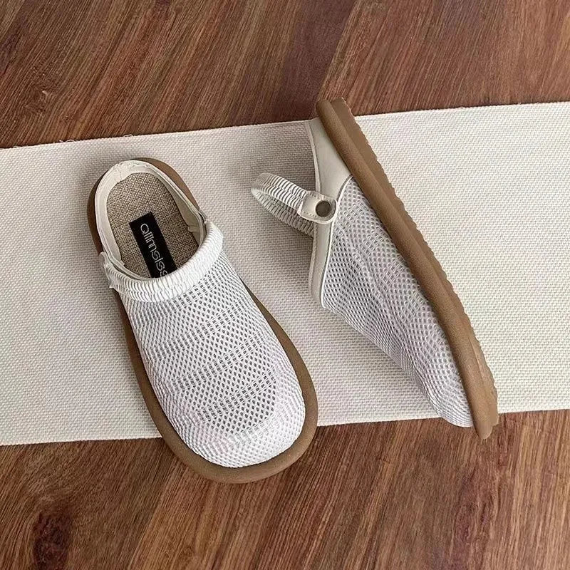 Beige linen slip-on hole shoes with mesh lining and a soft rubber sole, shown in a low-top style.