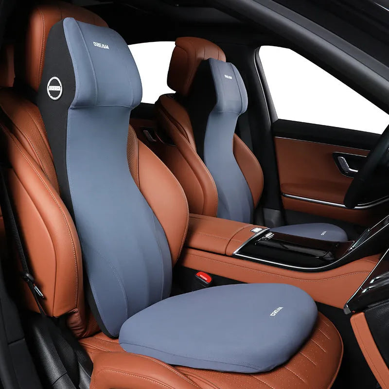 Black automotive memory foam mat showing integrated waist cushion and headrest lumbar support pillow on a car seat.