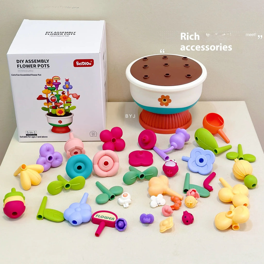 Colourful plastic flowerpot building block set with assorted flower-shaped pieces, in a colour box