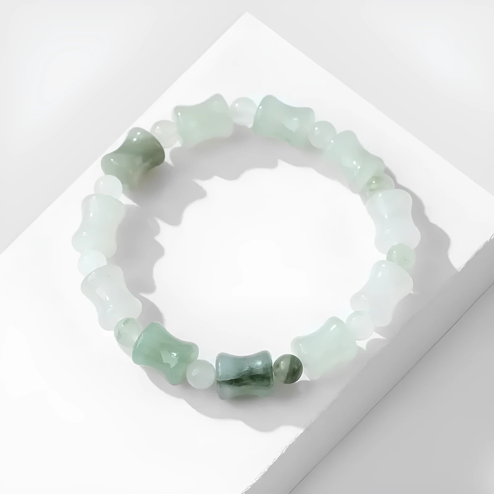 Natural chalcedony jade and coconut shell bead bracelet with diamond shapes and a safety lock clasp.