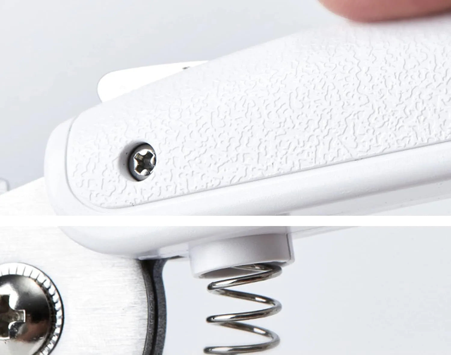 White pet nail clippers with LED light and transparent anti-splash guard next to a nail file on a table