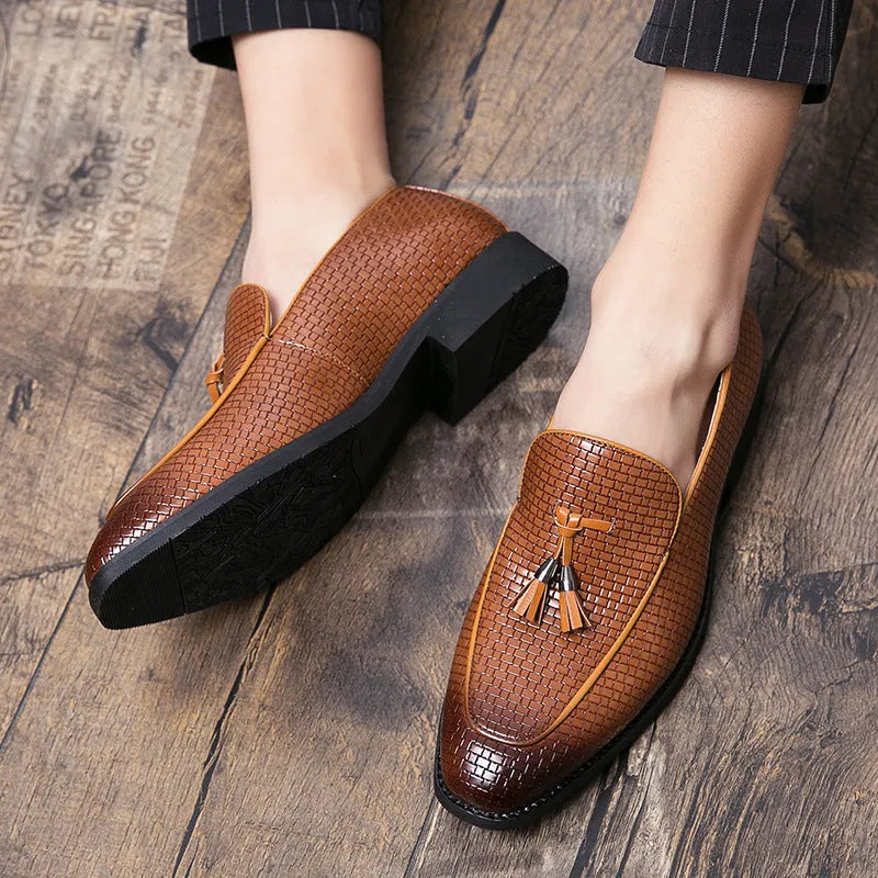 Men's black pointed toe slip-on shoe with a tassel on the low-top PU upper.
