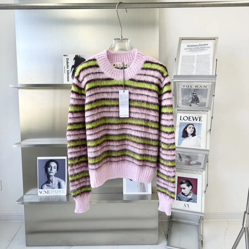 Pink lazy coat style wool blend cardigan with contrast colour detailing on a hanger.