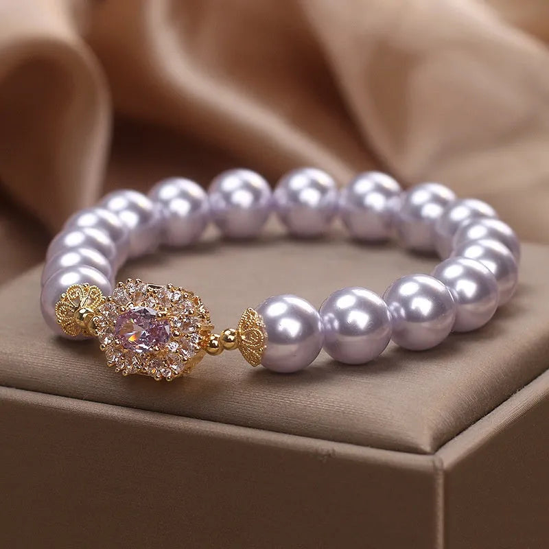 Dreamy purple zircon pearl bracelet with diamond flower charm on wrist