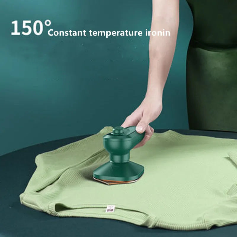 Dark green portable hanging steam ironing machine with ceramic panel and compact design.