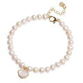 A women's freshwater pearl bracelet with a fan-shaped shell clasp, shown in both elastic and extension chain fastening styles.