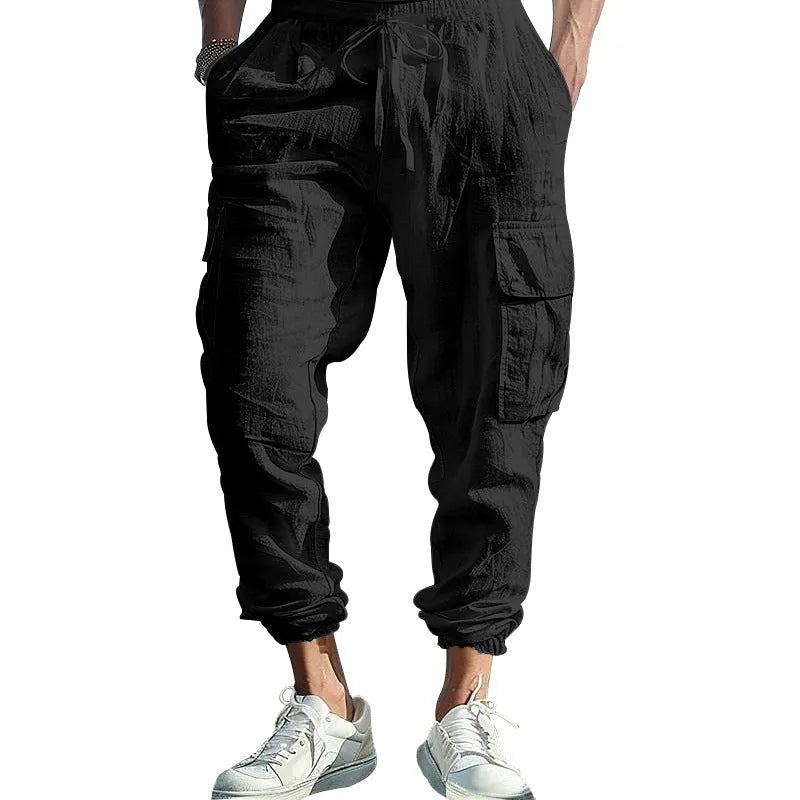 Men's linen casual trousers with ankle-tied cuffs and multiple pockets in a solid colour.