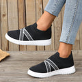 Black women's flyknit mesh shoes with flat rubber sole and tassel detail